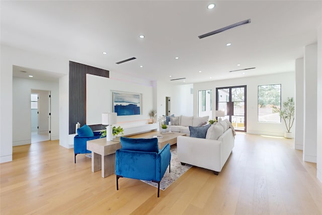 5055 Yarwell Dr, Houston, TX 77096 - living room featuring light wood finished floors and recessed lighting