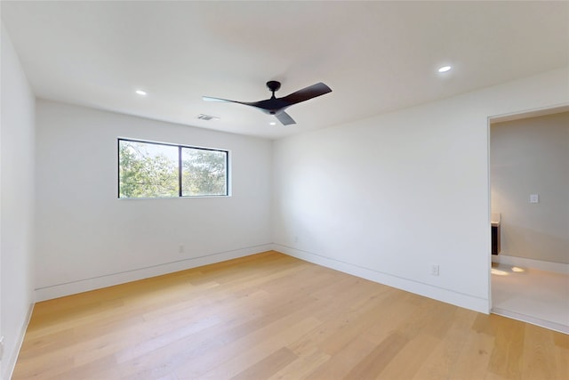 5055 Yarwell Dr, Houston, TX 77096 - empty room with light wood finished floors, ceiling fan, and recessed lighting