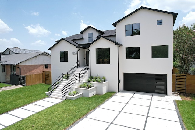 5055 Yarwell Dr, Houston, TX 77096 - view of front of property with an attached garage, stucco siding, and driveway