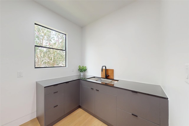 5055 Yarwell Dr, Houston, TX 77096 - bar area featuring a sink and light wood-type flooring