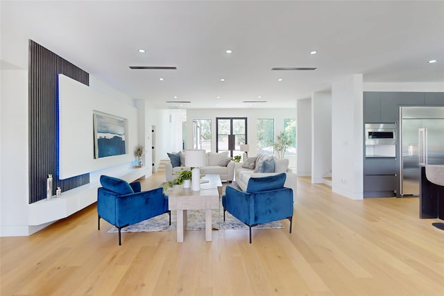 5055 Yarwell Dr, Houston, TX 77096 - living room with light wood finished floors and recessed lighting