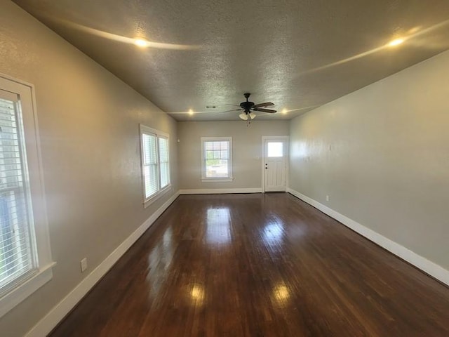 2301 45th St, Galveston, TX 77551 - spare room with a textured ceiling, wood finished floors, and a ceiling fan