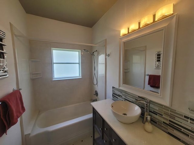 2301 45th St, Galveston, TX 77551 - bathroom featuring tub / shower combination, vanity, and backsplash