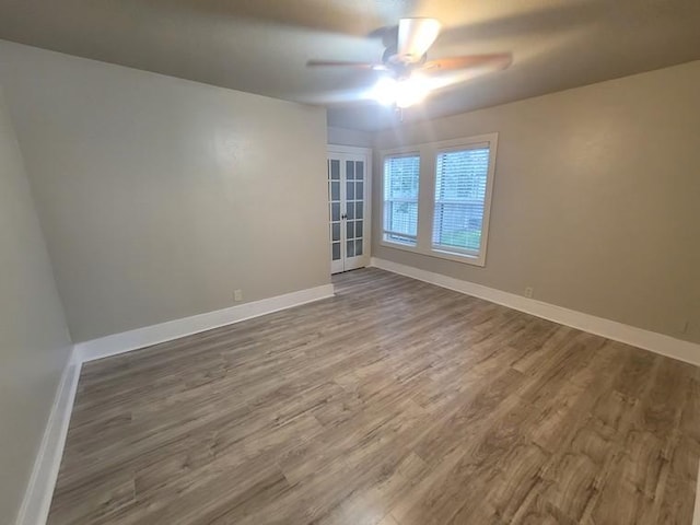 2301 45th St, Galveston, TX 77551 - unfurnished room with a ceiling fan and dark wood-style floors