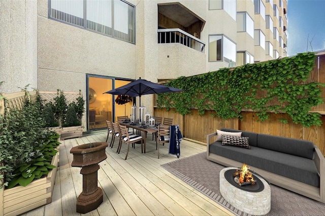 2001 Holcombe Blvd Unit 206, Houston, TX 77030 - deck featuring outdoor dining area and an outdoor living space with a fire pit