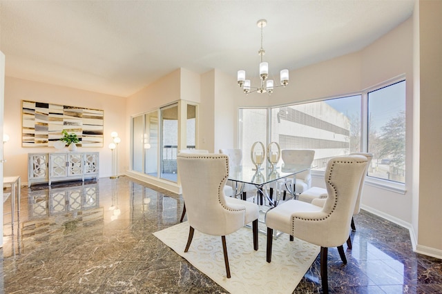 2001 Holcombe Blvd Unit 206, Houston, TX 77030 - dining area featuring a chandelier and marble tiled floors