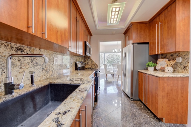 2001 Holcombe Blvd Unit 206, Houston, TX 77030 - kitchen with stainless steel appliances, brown cabinetry, a raised ceiling, and tasteful backsplash