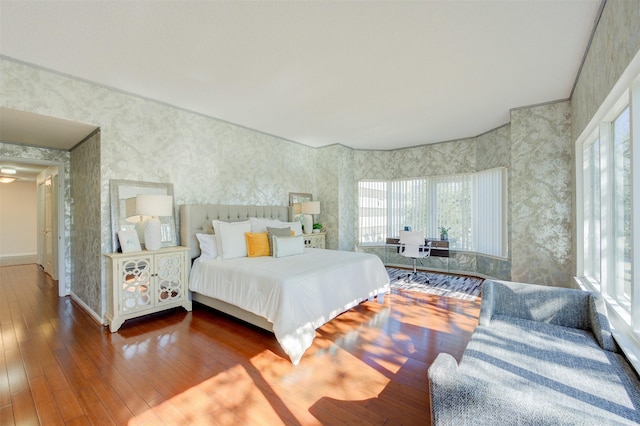 2001 Holcombe Blvd Unit 206, Houston, TX 77030 - bedroom featuring wallpapered walls and hardwood / wood-style floors