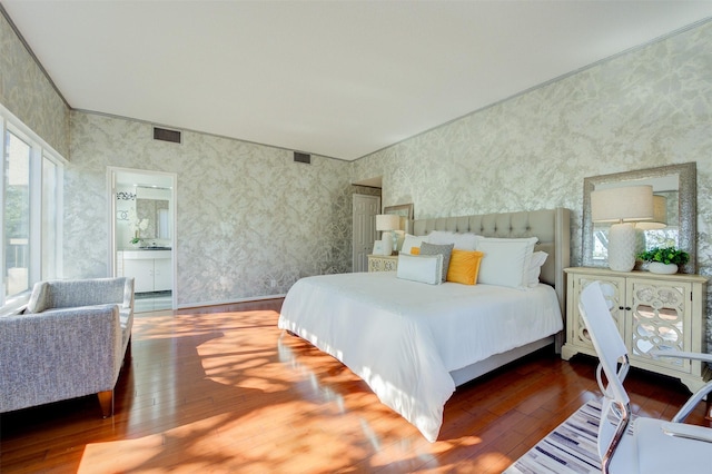 2001 Holcombe Blvd Unit 206, Houston, TX 77030 - bedroom with hardwood / wood-style floors and wallpapered walls