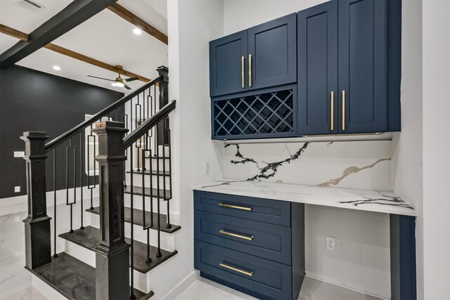 613 Melbourne St, Houston, TX 77022 - staircase with recessed lighting, beam ceiling, a ceiling fan, and marble finish flooring