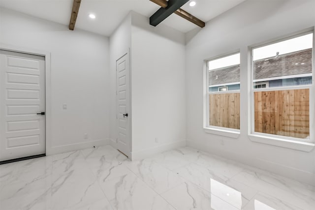 613 Melbourne St, Houston, TX 77022 - unfurnished room featuring beamed ceiling, marble finish floors, and recessed lighting