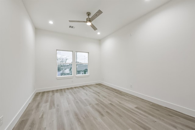 613 Melbourne St, Houston, TX 77022 - empty room featuring light wood finished floors, a ceiling fan, and recessed lighting