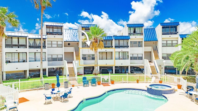 14401 Commodores Dr Unit 104, Corpus Christi, TX 78418 - view of pool featuring a patio area and a pool with connected hot tub