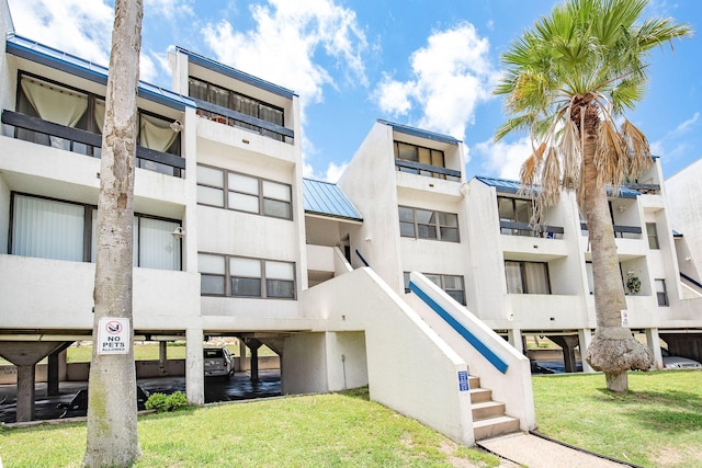 14401 Commodores Dr Unit 104, Corpus Christi, TX 78418 - view of apartment building / complex featuring stairs