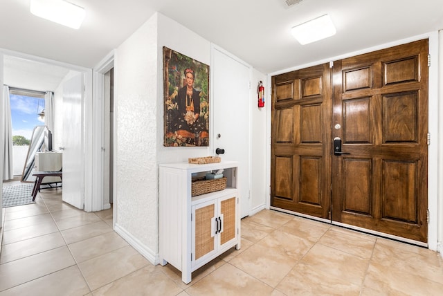14401 Commodores Dr Unit 104, Corpus Christi, TX 78418 - entryway featuring light tile patterned floors and baseboards