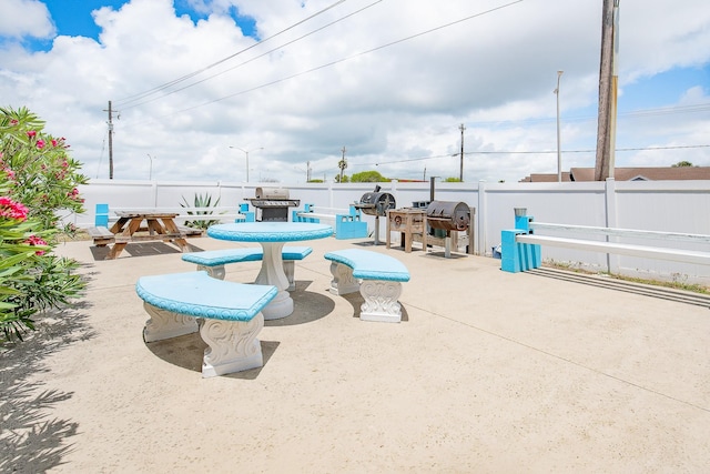14401 Commodores Dr Unit 104, Corpus Christi, TX 78418 - view of swimming pool with a patio, outdoor dining area, and a grill