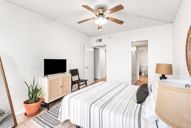 14401 Commodores Dr Unit 104, Corpus Christi, TX 78418 - bedroom with ensuite bath and ceiling fan