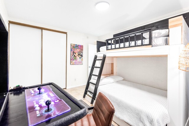 14401 Commodores Dr Unit 104, Corpus Christi, TX 78418 - bedroom featuring a closet and tile patterned flooring