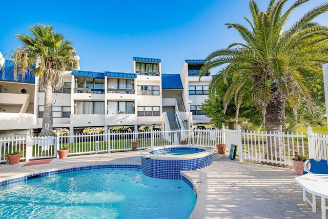 14401 Commodores Dr Unit 104, Corpus Christi, TX 78418 - view of pool with a pool with connected hot tub