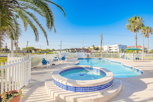 14401 Commodores Dr Unit 104, Corpus Christi, TX 78418 - view of pool with a patio and a pool with connected hot tub