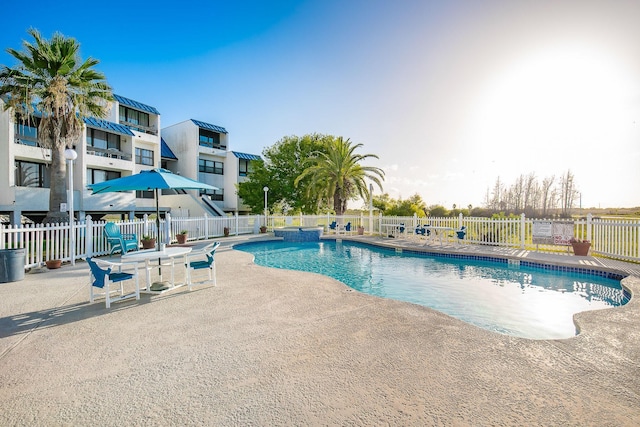 14401 Commodores Dr Unit 104, Corpus Christi, TX 78418 - view of swimming pool with a patio area and a pool with connected hot tub