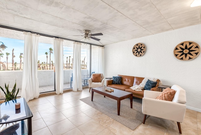 14401 Commodores Dr Unit 104, Corpus Christi, TX 78418 - living area with ceiling fan, a textured wall, and light tile patterned floors