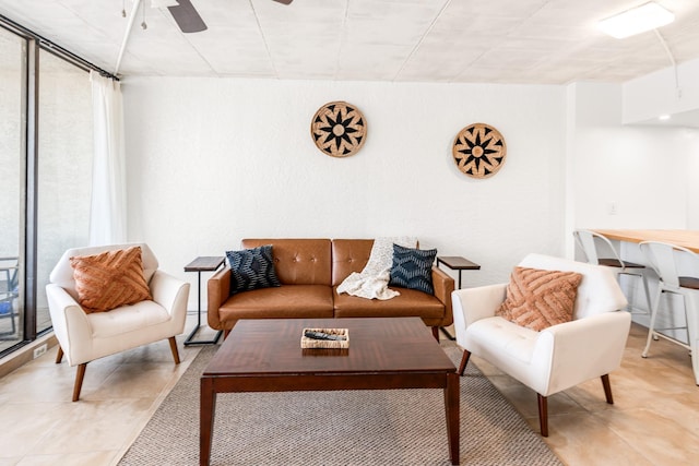 14401 Commodores Dr Unit 104, Corpus Christi, TX 78418 - living room featuring a ceiling fan and light tile patterned floors