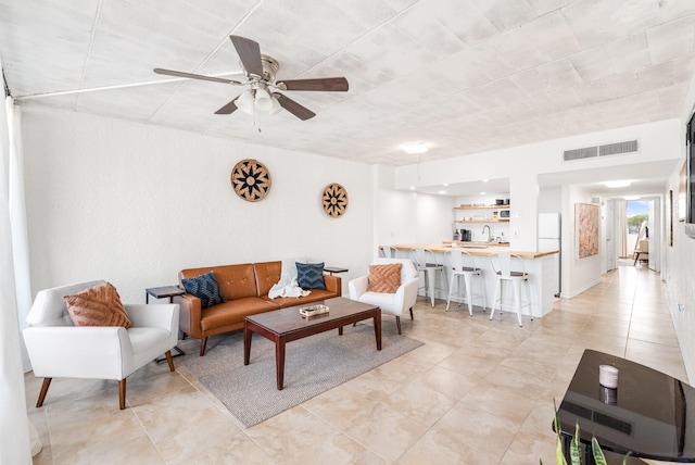 14401 Commodores Dr Unit 104, Corpus Christi, TX 78418 - living room with ceiling fan and light tile patterned floors