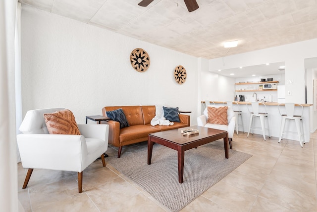 14401 Commodores Dr Unit 104, Corpus Christi, TX 78418 - living room with a ceiling fan, light tile patterned flooring, and bar