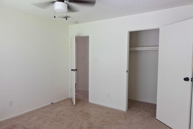 12227 Gun Oak Pl, The Woodlands, TX 77380 - unfurnished bedroom with carpet, a closet, and a ceiling fan