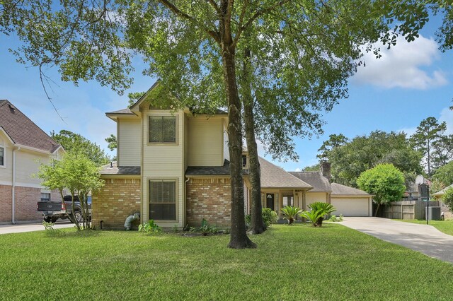 3519 El James Dr, Spring, TX 77388 - traditional home featuring brick siding, a shingled roof, and a garage