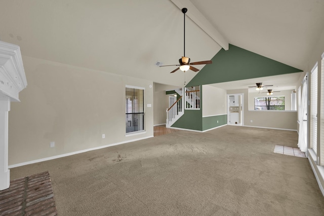 3519 El James Dr, Spring, TX 77388 - unfurnished living room featuring a ceiling fan, carpet flooring, beamed ceiling, stairs, and high vaulted ceiling