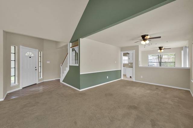 3519 El James Dr, Spring, TX 77388 - carpeted foyer with a ceiling fan, tile patterned floors, and stairway