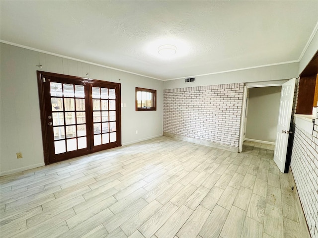 7905 Turquoise Ln, Houston, TX 77055 - unfurnished room with ornamental molding, light wood-type flooring, and a textured ceiling