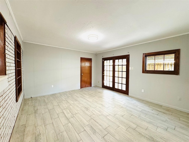 7905 Turquoise Ln, Houston, TX 77055 - unfurnished room with french doors, plenty of natural light, light wood-type flooring, and ornamental molding