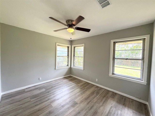 7905 Turquoise Ln, Houston, TX 77055 - spare room featuring a ceiling fan and wood finished floors
