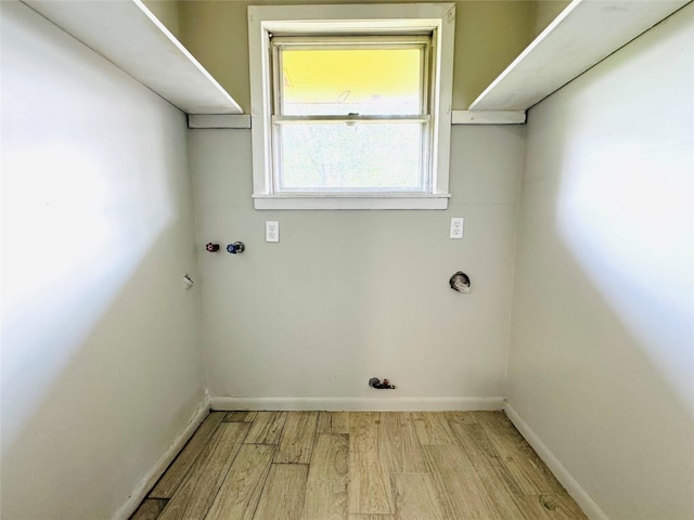 7905 Turquoise Ln, Houston, TX 77055 - laundry area featuring wood finished floors and hookup for a washing machine
