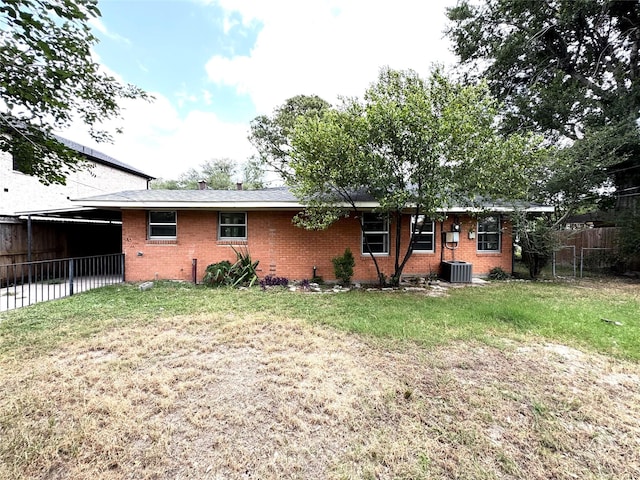 7905 Turquoise Ln, Houston, TX 77055 - rear view of house featuring brick siding and an attached carport