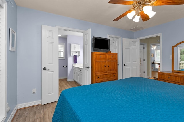 80 Indian Hbr, Trinity, TX 75862 - bedroom with light wood-type flooring, a ceiling fan, and ensuite bathroom