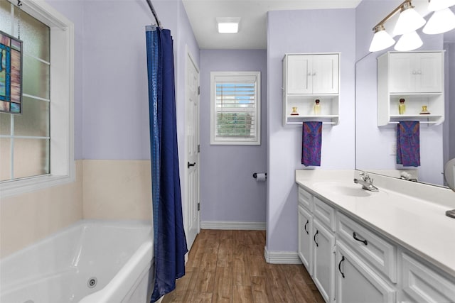 80 Indian Hbr, Trinity, TX 75862 - bathroom with a tub with jets, vanity, and wood finished floors