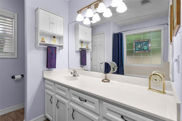 80 Indian Hbr, Trinity, TX 75862 - full bathroom featuring vanity, wood finished floors, and a shower with curtain
