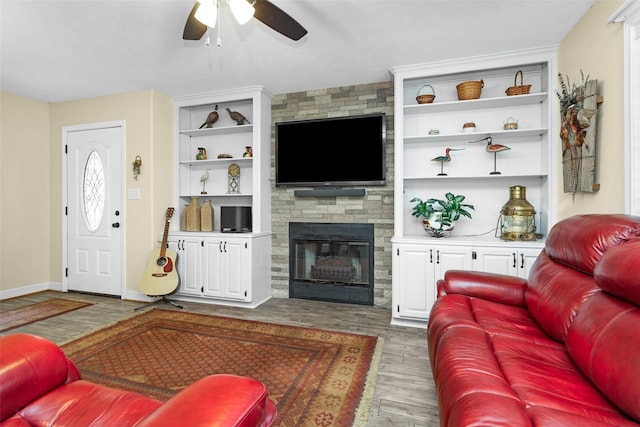 80 Indian Hbr, Trinity, TX 75862 - living area with ceiling fan, wood finished floors, a fireplace, and built in shelves