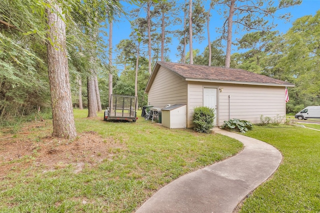 80 Indian Hbr, Trinity, TX 75862 - view of grassy yard featuring an outbuilding