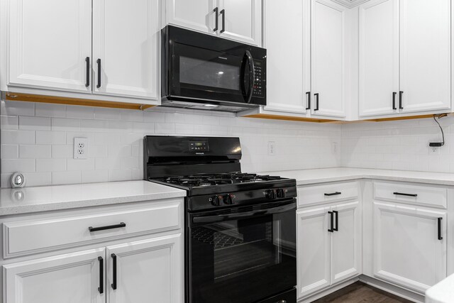 11323 Cora Ln, Willis, TX 77318 - kitchen featuring black appliances, light countertops, white cabinetry, and tasteful backsplash