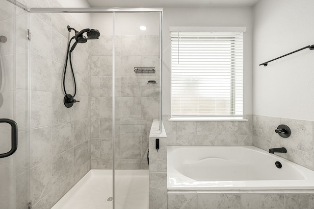 11323 Cora Ln, Willis, TX 77318 - full bathroom with a stall shower, a bath, and healthy amount of natural light