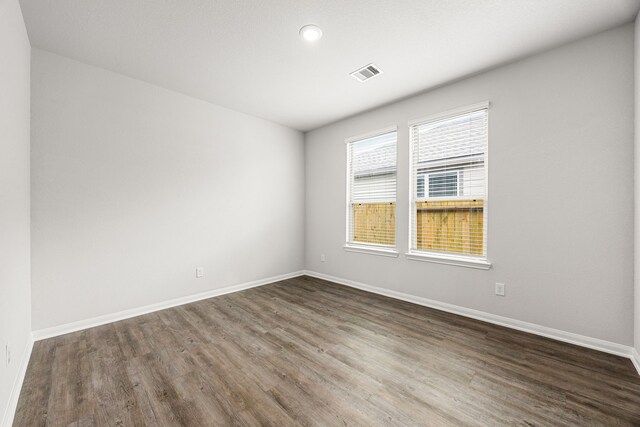 11323 Cora Ln, Willis, TX 77318 - unfurnished room featuring dark wood finished floors