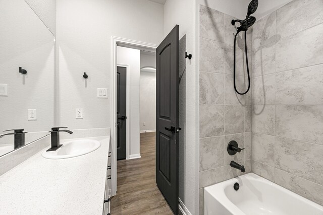 11323 Cora Ln, Willis, TX 77318 - full bathroom featuring bathtub / shower combination, wood finished floors, and vanity