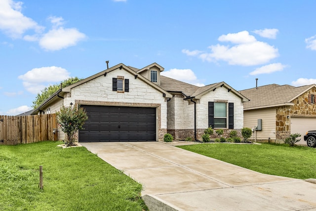 11323 Cora Ln, Willis, TX 77318 - view of front of property with stone siding, driveway, roof with shingles, and a garage