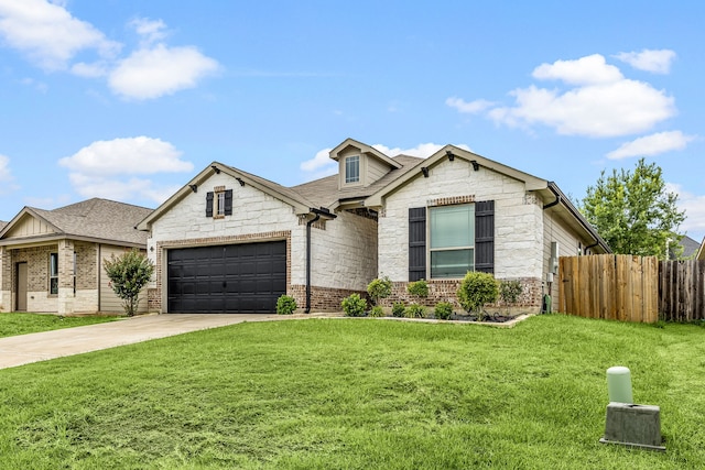 11323 Cora Ln, Willis, TX 77318 - view of front facade with driveway, brick siding, a garage, stone siding, and roof with shingles