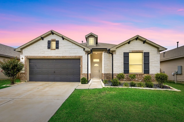 11323 Cora Ln, Willis, TX 77318 - view of front of property featuring driveway, a front yard, brick siding, and stone siding